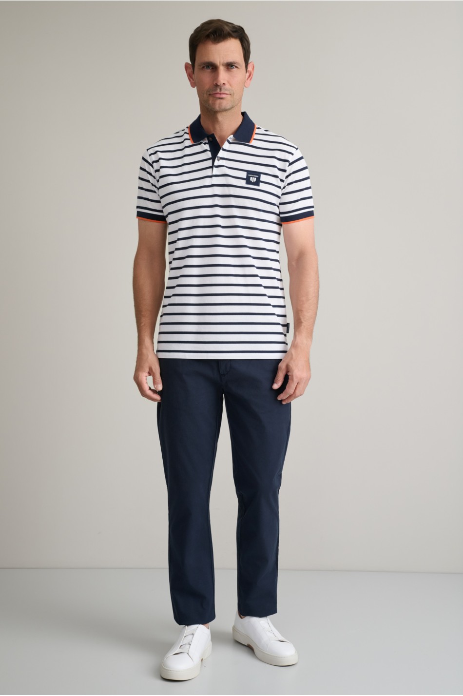 Striped cotton piqué polo shirt with detailing